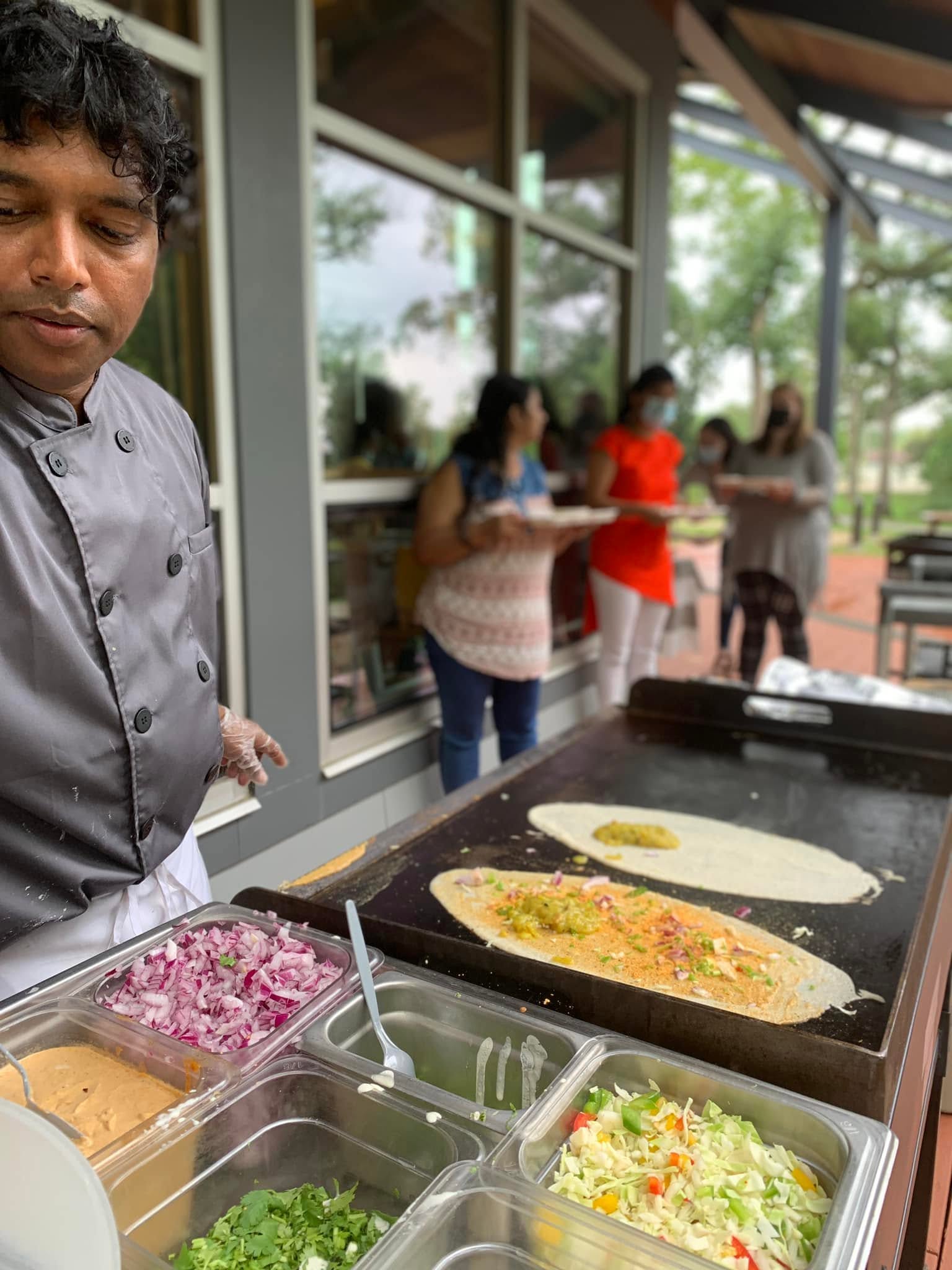 Chef making fresh dosas at a live dosa party at Taste of India, Willowbrook IL