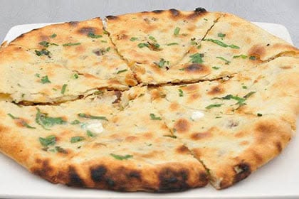 Stuffed kulcha flatbread fresh from the tandoor at Taste of India, Willowbrook IL